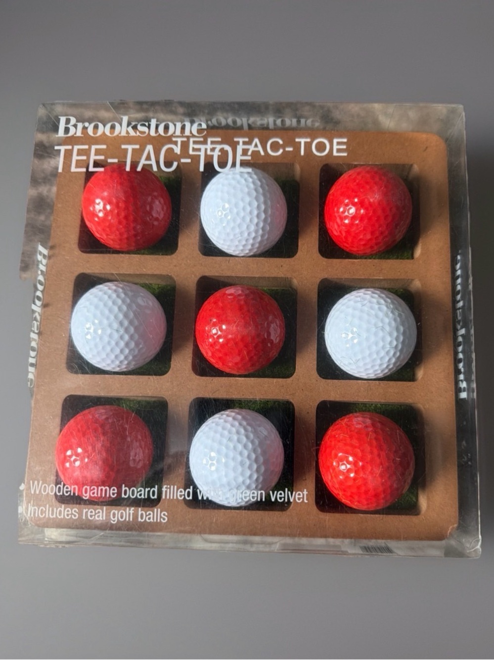 Brookstone Tee-Tac-Toe game. Wooden board with included real golf balls. NIB.